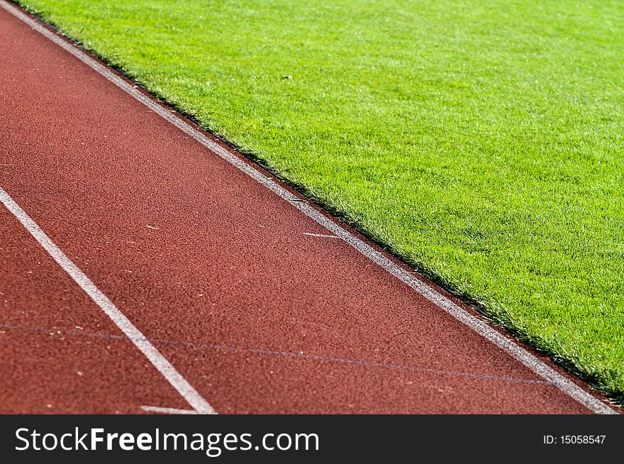 Diagonal race track in soccer stadium in su light