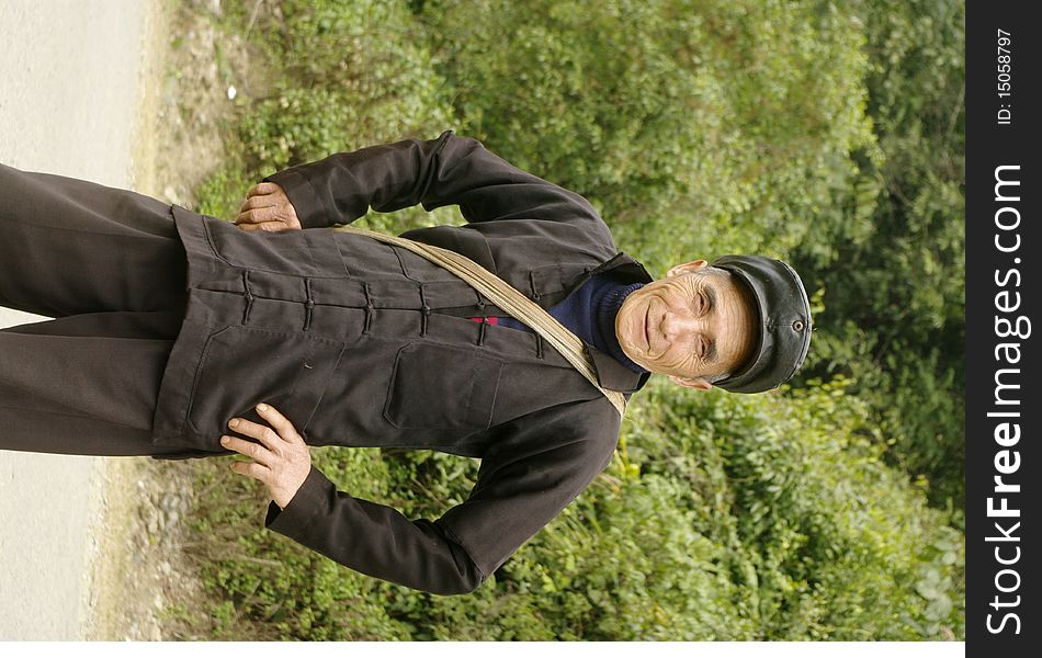 Man of the Hmong in traditional dress. He wears the hat because we Chinese are near the border. Man of the Hmong in traditional dress. He wears the hat because we Chinese are near the border