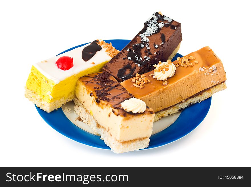 Cakes on plate isolated on white background