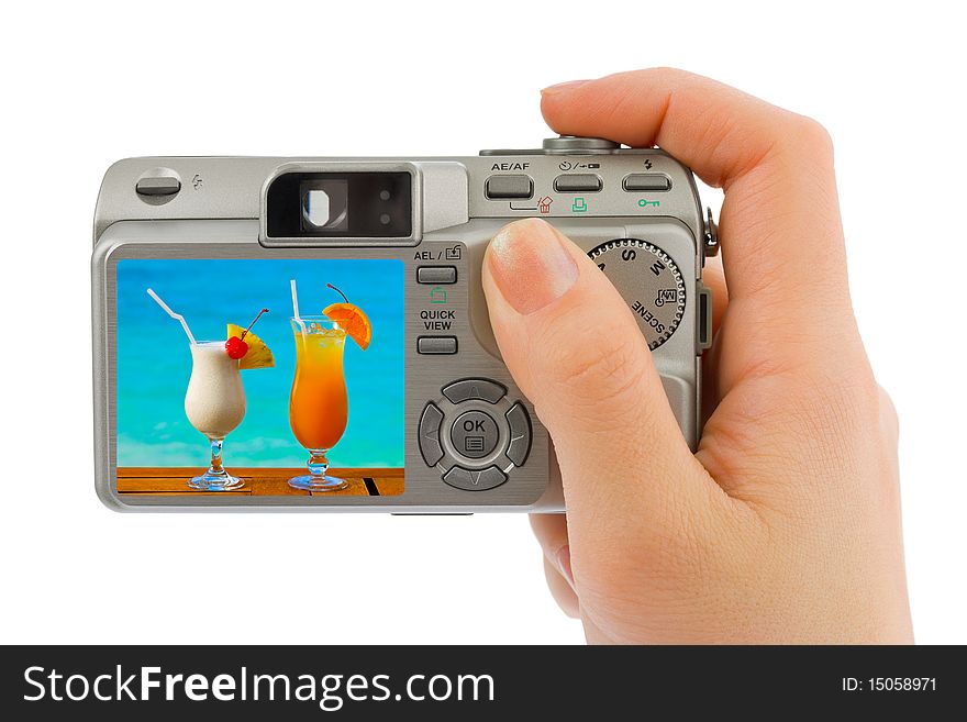 Hand with camera and landscape (my photo) isolated on white background