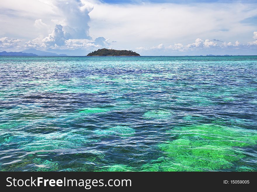 Seascape. Turquoise water, clouds, Islands on horizon. Seascape. Turquoise water, clouds, Islands on horizon