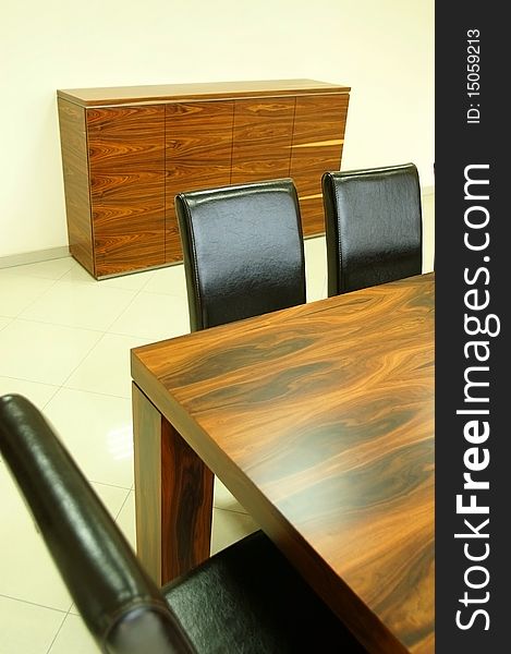Wooden Table And Leather Black Chairs