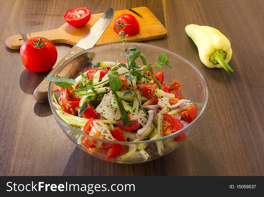 Salad in glass dish in the kitchen