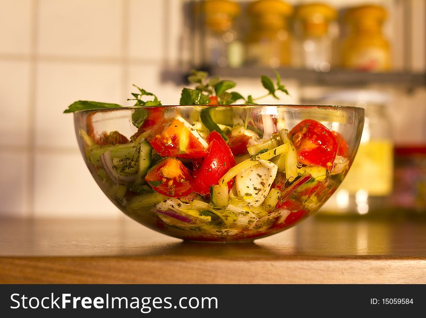 Salad in glass dish in the kitchen