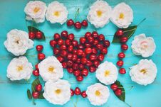 Fresh White Roses With Water Drops, Red Cherry In A Shape Of A Heart On An Old Painted Wooden Table As A Bright Colorful Summer Stock Photos