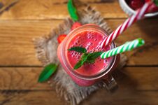 Strawberry Smoothie In A Glass Jar With Fresh Mint, On Wooden Background, Top View Royalty Free Stock Photos
