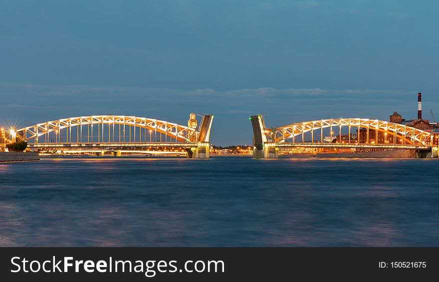 Bolsheokhtinsky bridge in St. Petersburg at night with open spans over the Neva