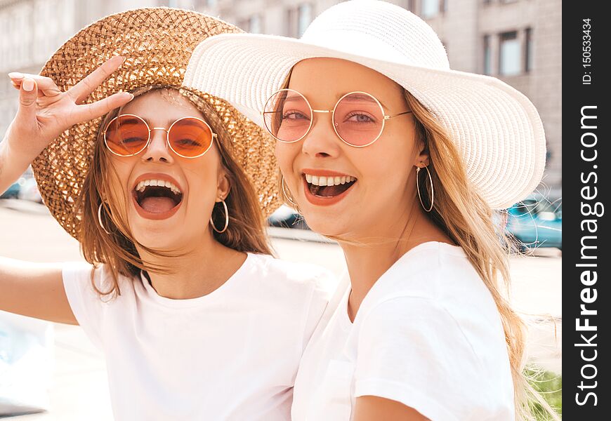 Two Young Smiling Hipster Blond Women In Summer White T-shirt Clothes