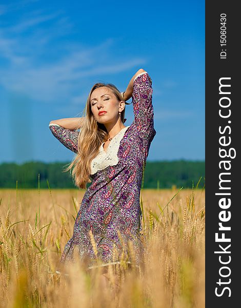 Beauty girl in the wheat field