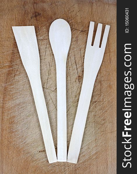 Collection of wooden spoons on wooden background