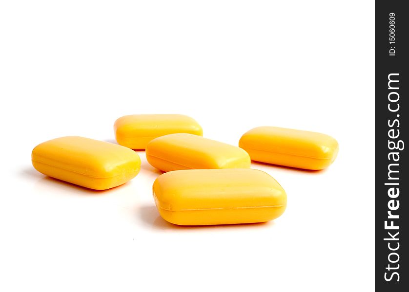 Yellow soap on a white background