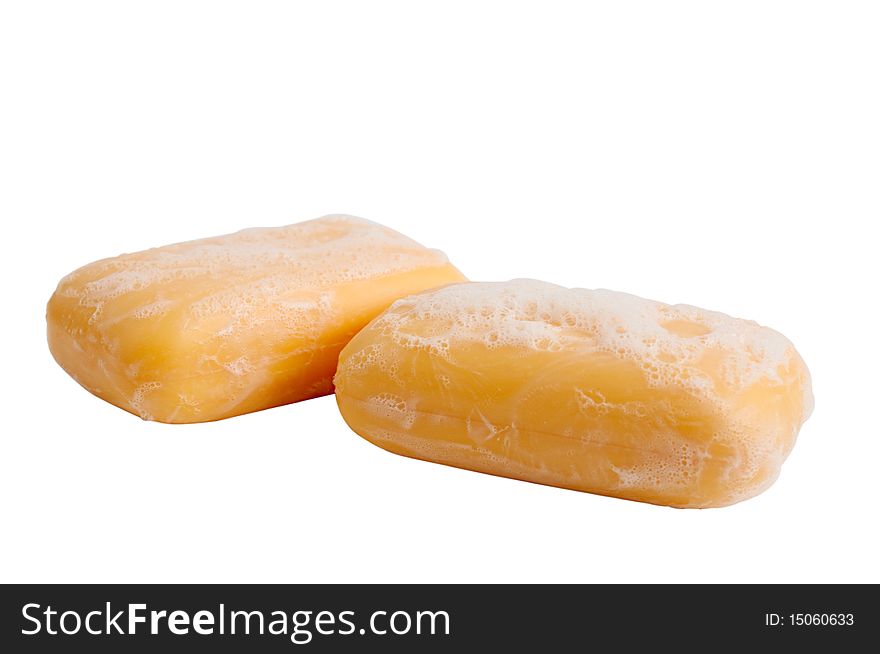 Yellow soap on a white background