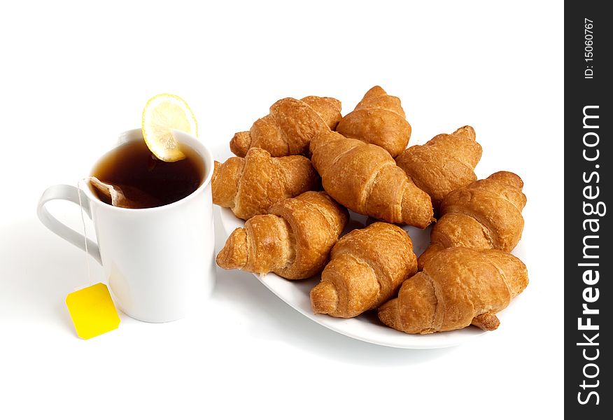 Croissants and tea on a white background