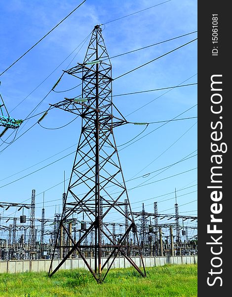 High-tension power line with clouds on background. High-tension power line with clouds on background