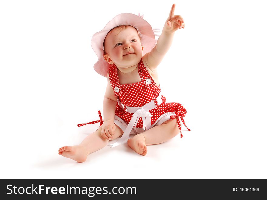 Little baby girl in red dress and hat