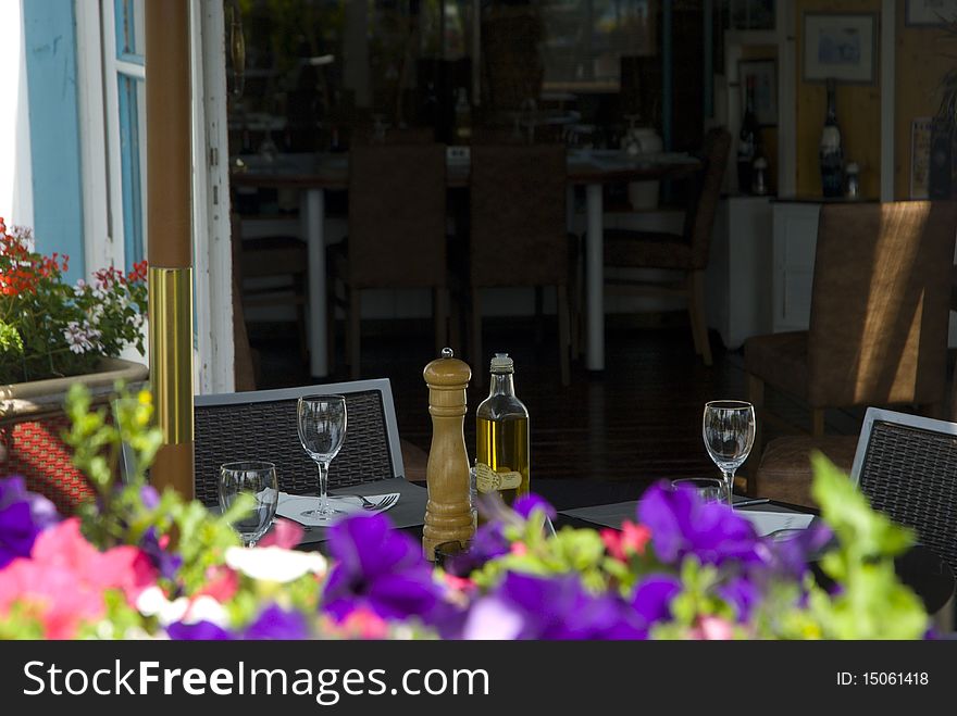 Open-air restaurant with flowers small garden