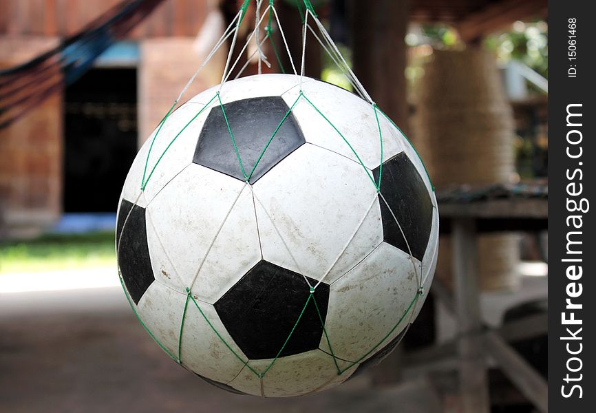 Isolate old football in net