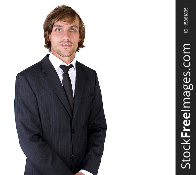 Young fresh confident businessman with longer hair over a greyish background. Young fresh confident businessman with longer hair over a greyish background.
