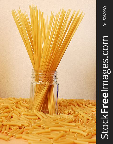 Spaghetti and macaroni on a table