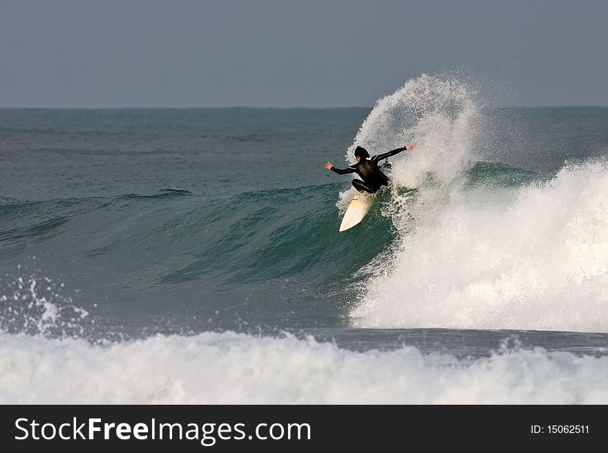 Surfer Kickback On A Wave