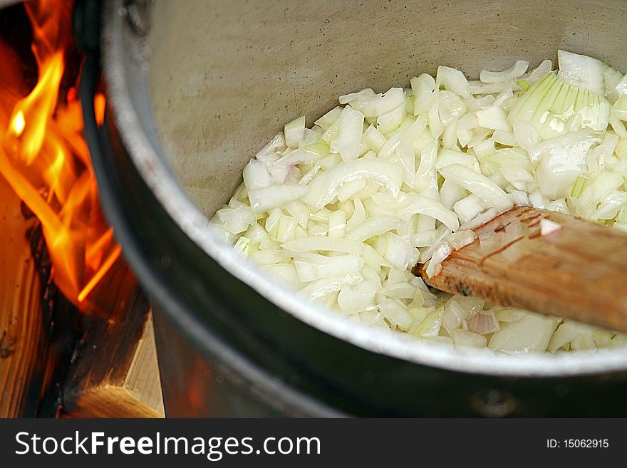 Frying fresh onion for goulash. Frying fresh onion for goulash