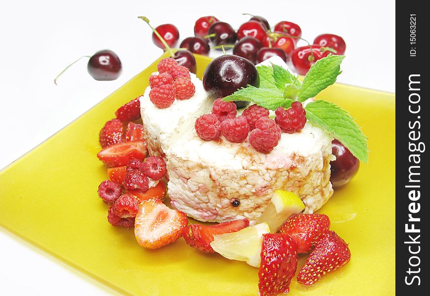 Raspberry fruit dessert with pudding cherry and fresh mint