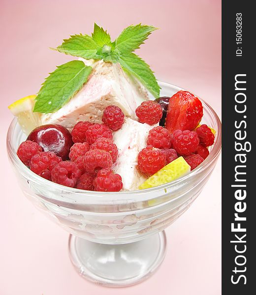 Raspberry dessert with pudding strawberry cherry and mint