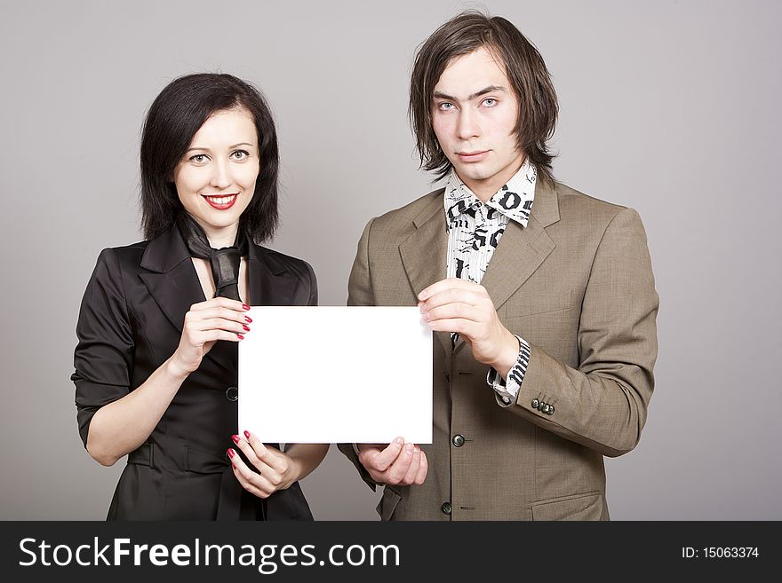 Three business person woman and man to hold a paper look in a chamber. Three business person woman and man to hold a paper look in a chamber