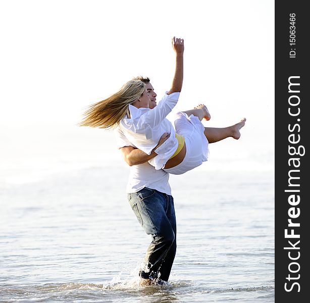 Young couple have fun in the ocean. Young couple have fun in the ocean