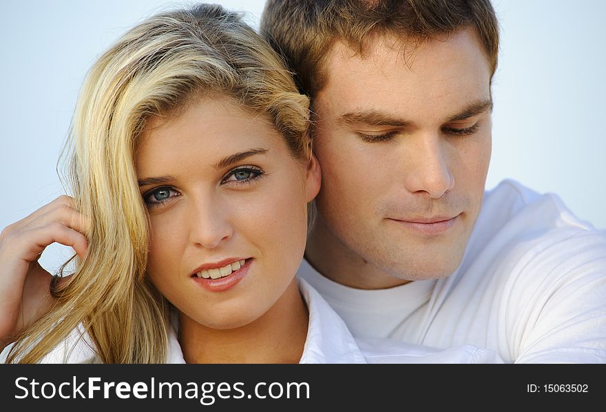 Lovely closeup portrait of an attractive young couple. Lovely closeup portrait of an attractive young couple