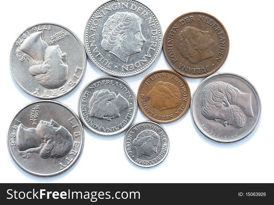 Different metal coins over white