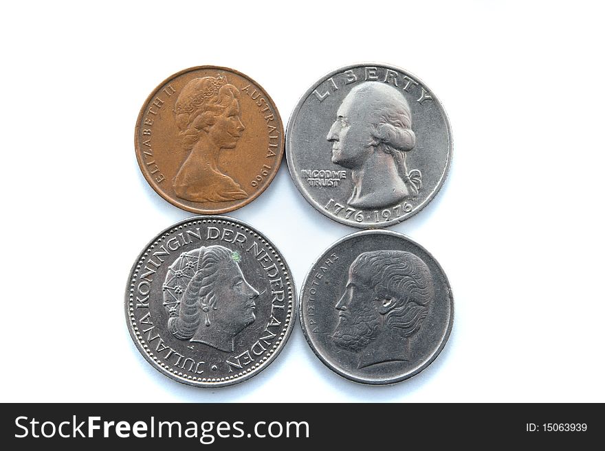 Different metal coins over white