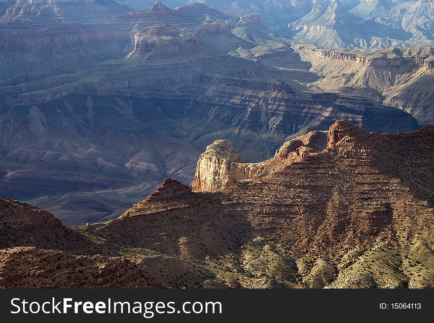 Scenic view of a peak in the Grand Canyon in the evening. Scenic view of a peak in the Grand Canyon in the evening.