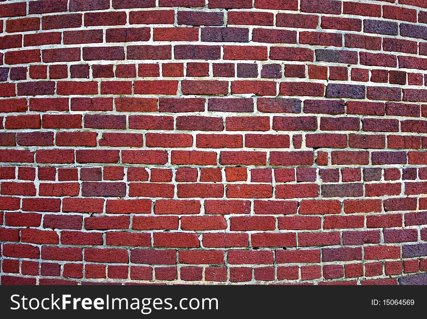 Curved brick wall, with irregular shaped bricks. Curved brick wall, with irregular shaped bricks