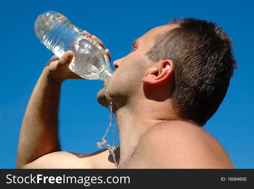 Stubble man drinking a water