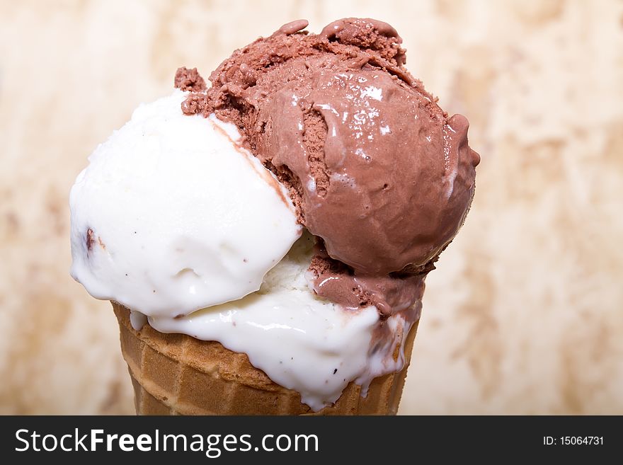 Chocolate and vanilla ice cream in a cone