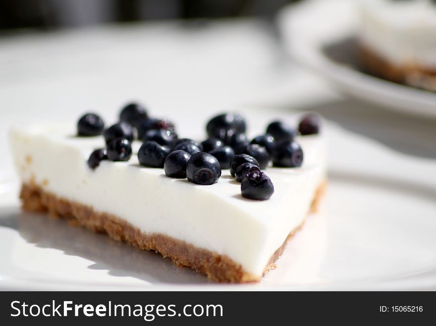 Blueberry cheesecake slice on a plate