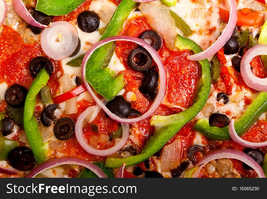 Pizza with pepperoni, bell peppers, black olives and onions. Pizza with pepperoni, bell peppers, black olives and onions