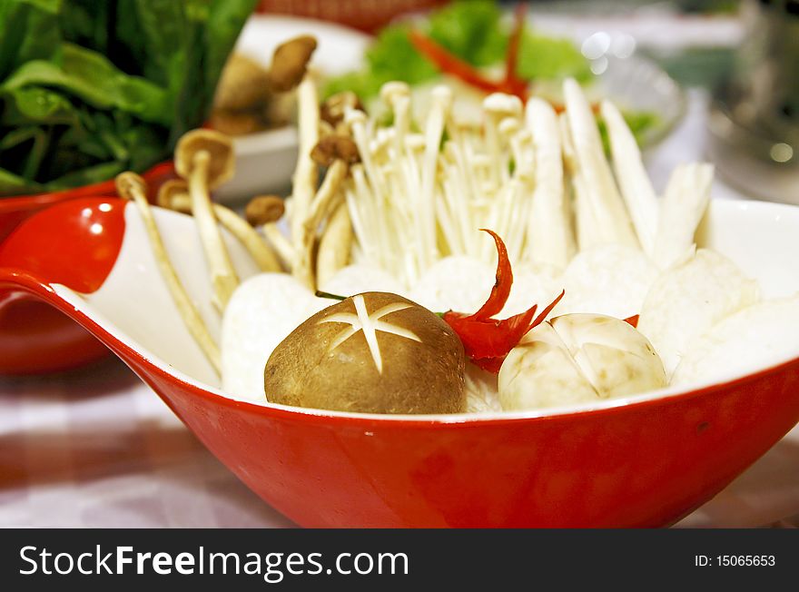 A variety of fresh mushrooms in a bowl They will be used for Chinese hot pot.