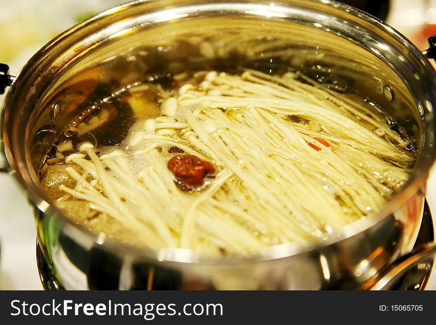 Close-up of the nourishing hot pot.It has the keeping in good health function. Close-up of the nourishing hot pot.It has the keeping in good health function.