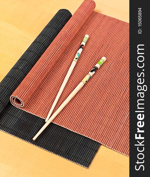Oriental Chop Sticks and Bamboo Dining Mats for asian cuisine concepts. Oriental Chop Sticks and Bamboo Dining Mats for asian cuisine concepts