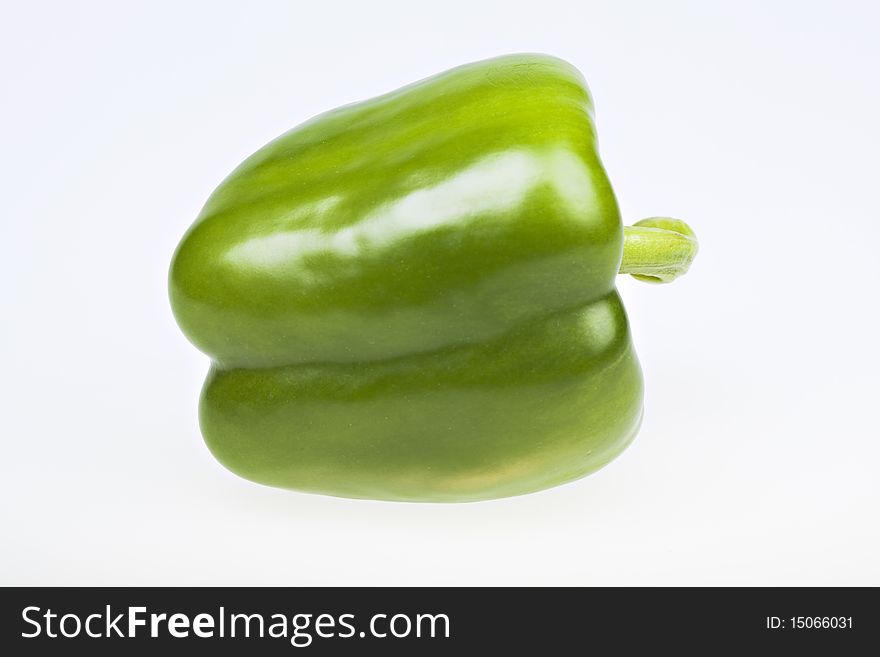 Green yellow pepper isolated on white