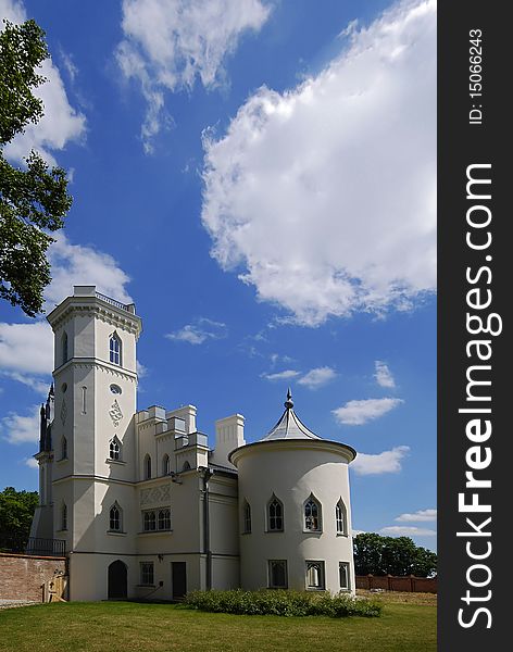 Gothic palace with the garden into a sunny day. Gothic palace with the garden into a sunny day