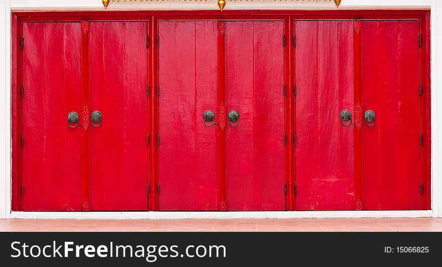 Triple Red Doors with lion head knobs, Chinese decoration style.