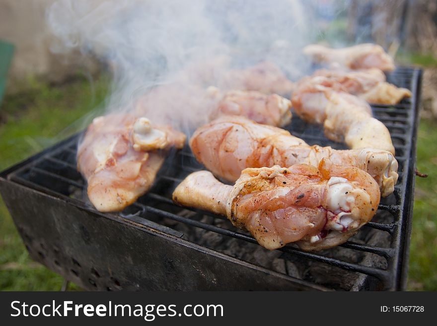 Grilled chicken marinated with spices and raw