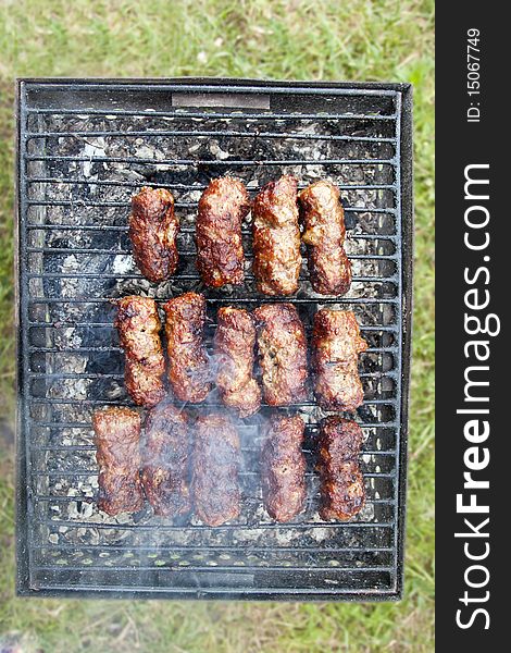 Traditional food mici cooked grilled minced barbecue smoke