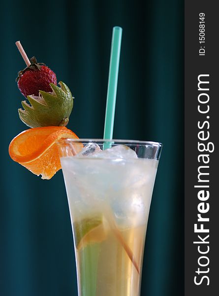 Coctail with ice and straw in glass. Coctail with ice and straw in glass