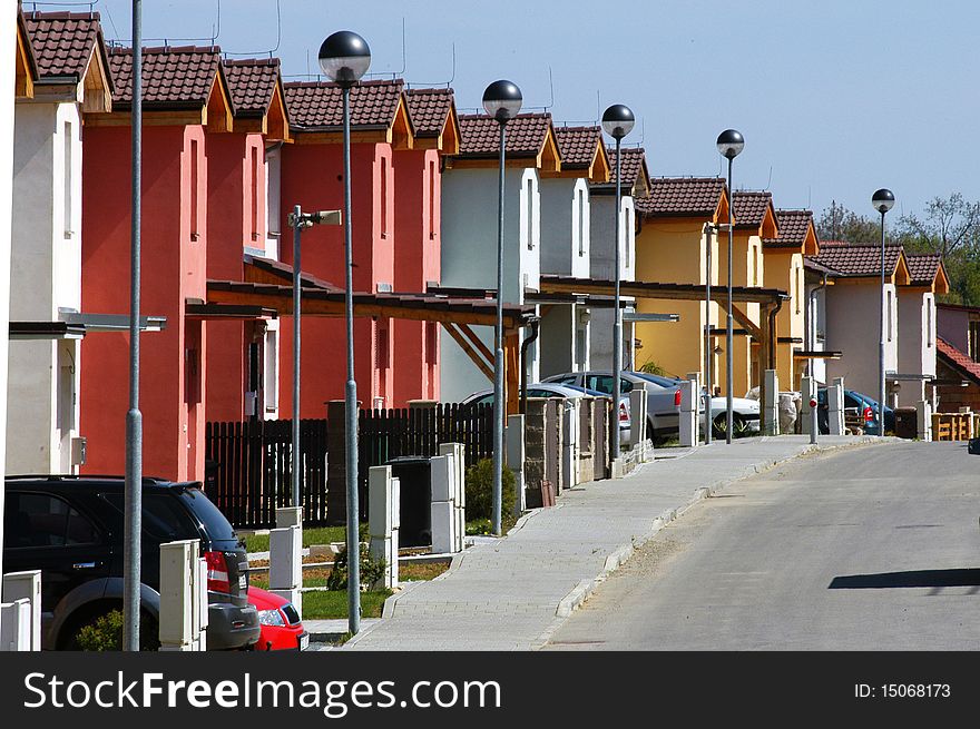 Raw of white red and yellow houses. Raw of white red and yellow houses