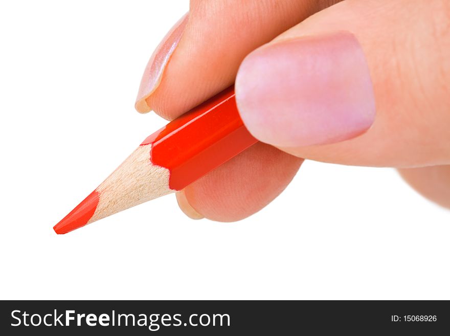 Red pencil in hand isolated on white background