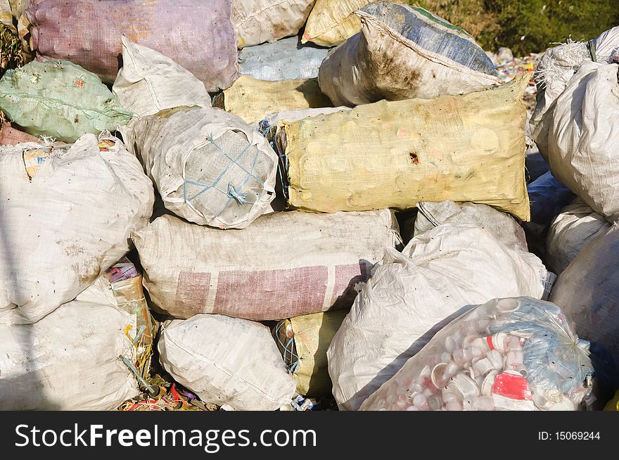 Sacks and sacks of refuse in a garbage dump